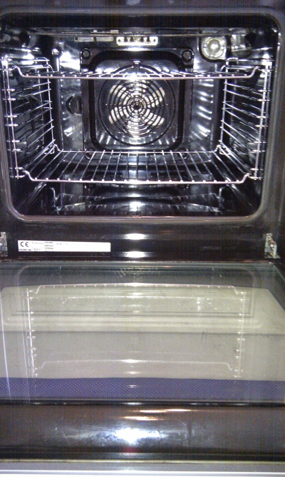 The same fan oven after a Celsius clean, racks and door glass gleaming